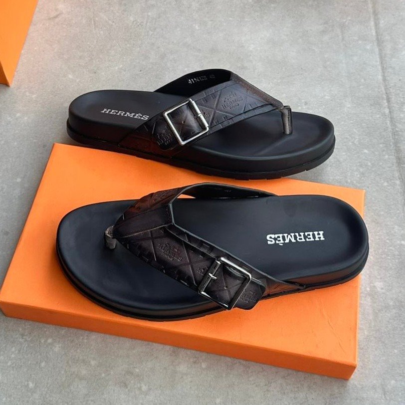 290b9036-6cee-4d7e-b439-c44e07873777 Hermes embroidered canva leather flip-flop - Image 1