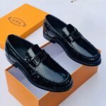 Tods Luco logo embellished patent leather black