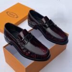 Tods Luco logo embellished patent leather wine colour