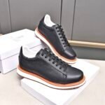 Brunello Cucinelli men's full grain leather sneakers with a contrasting orange sole Black colour