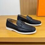Dior men’s flat pebble – grain leather loafers with contrasting white rubber sole. Black