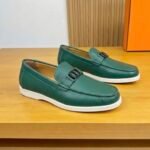 Dior men’s flat pebble – grain leather loafers with contrasting white rubber sole. Green
