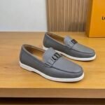 Dior men’s flat pebble – grain leather loafers with contrasting white rubber sole. Grey
