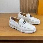 Dior men’s flat pebble – grain leather loafers with contrasting white rubber sole. White