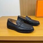 Dior men’s flat pebble – grain leather loafers with contrasting white rubber sole. Black